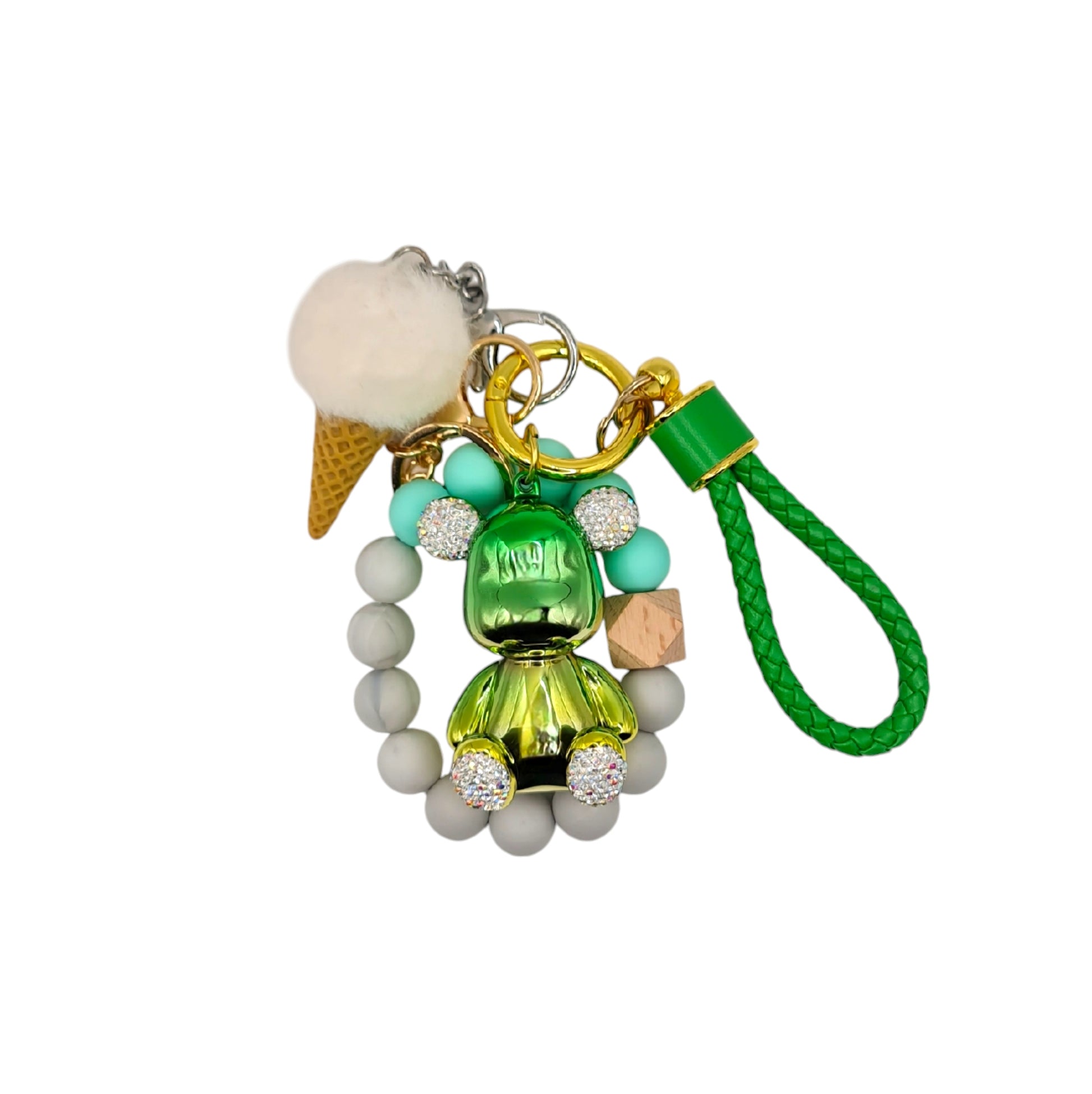 Cute and colorful ice cream-themed keychain featuring a white pom-pom, a gold metallic teddy bear charm with diamond ears, and a beaded green leather like strap.