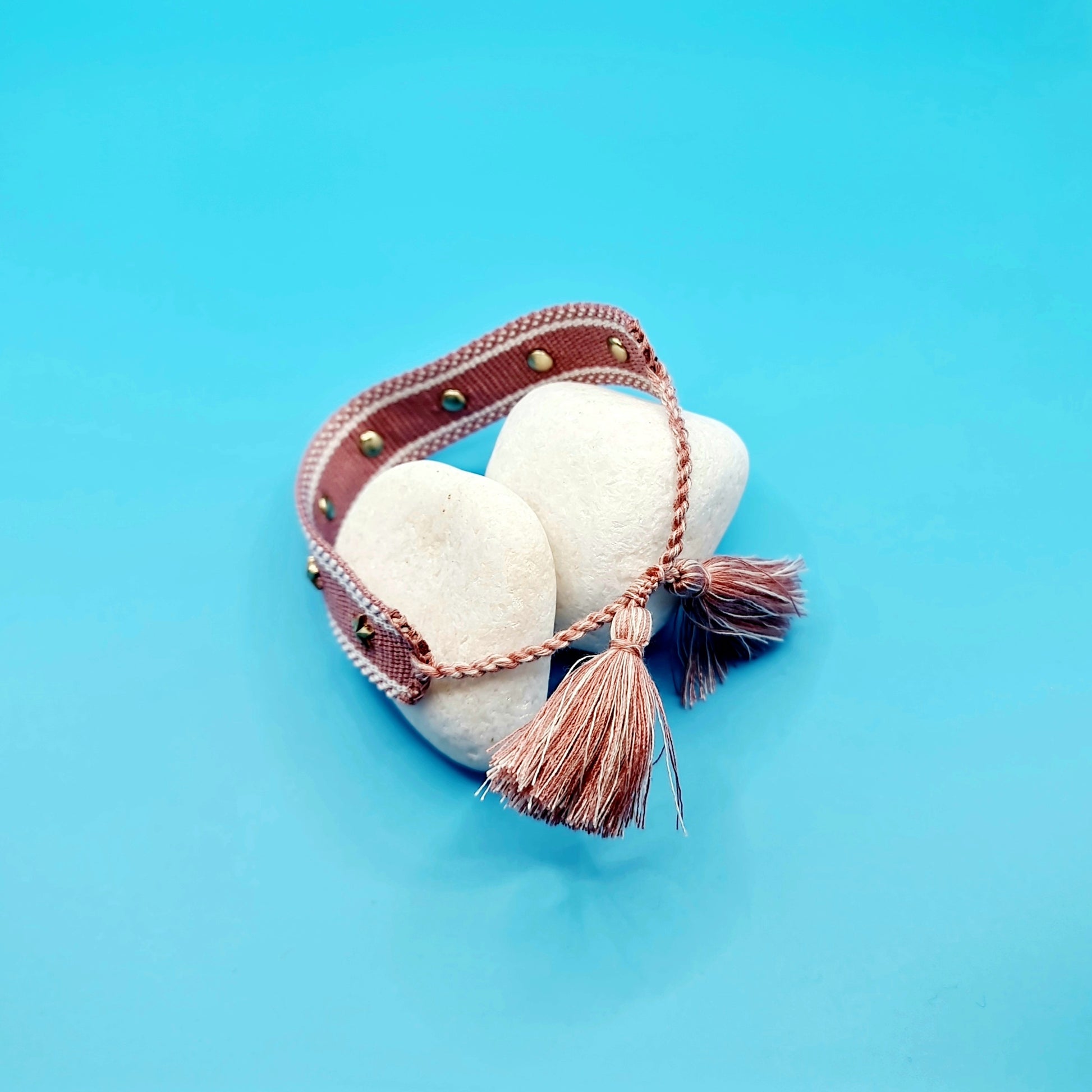 women fashion costume jewellery pink bracelet, with gold star inclusions tassels, back view, arcobaleno beads