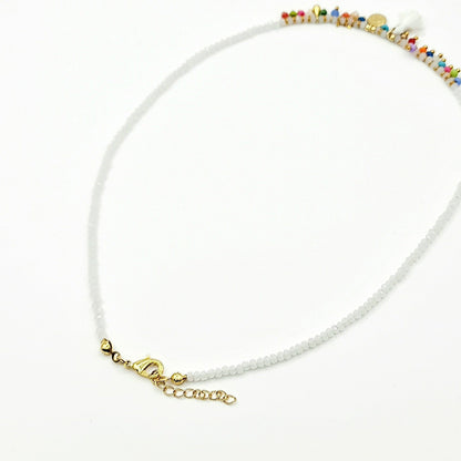 bead by bead crystal white costume jewellery necklace, highlight multicolour beads tassle back veiw, arcobaleno beads