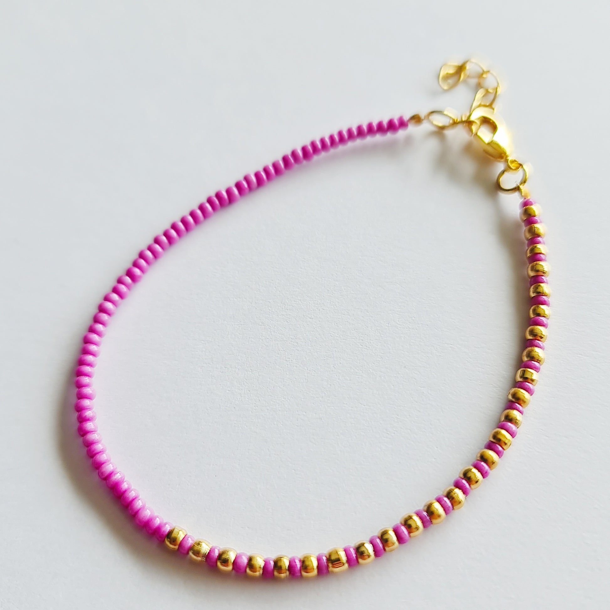 beaded bracelets, beaded jewellery, multicoloured bead bracelets, pink and gold beaded bracelet