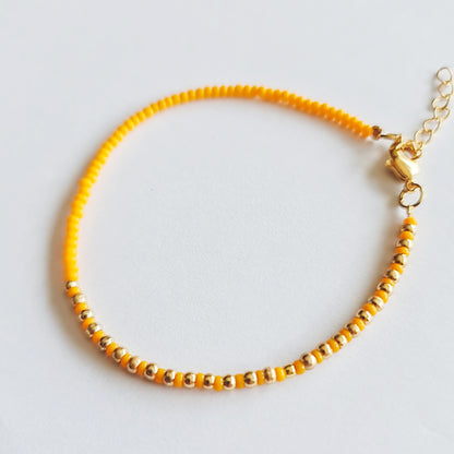 beaded bracelets, beaded jewellery, multicoloured bead bracelets, orange and gold beaded bracelet