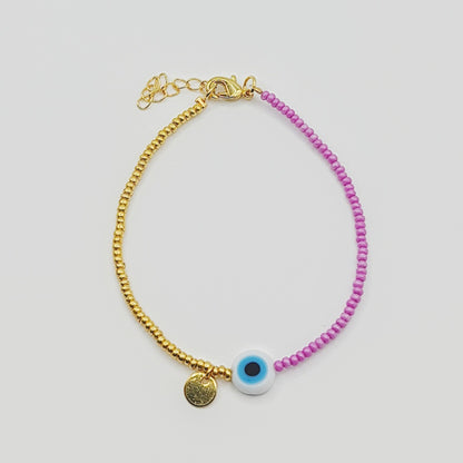 Seed Bead Gold with purple, evil eye bracelet with gold feature, top veiw, arcobaleno beads