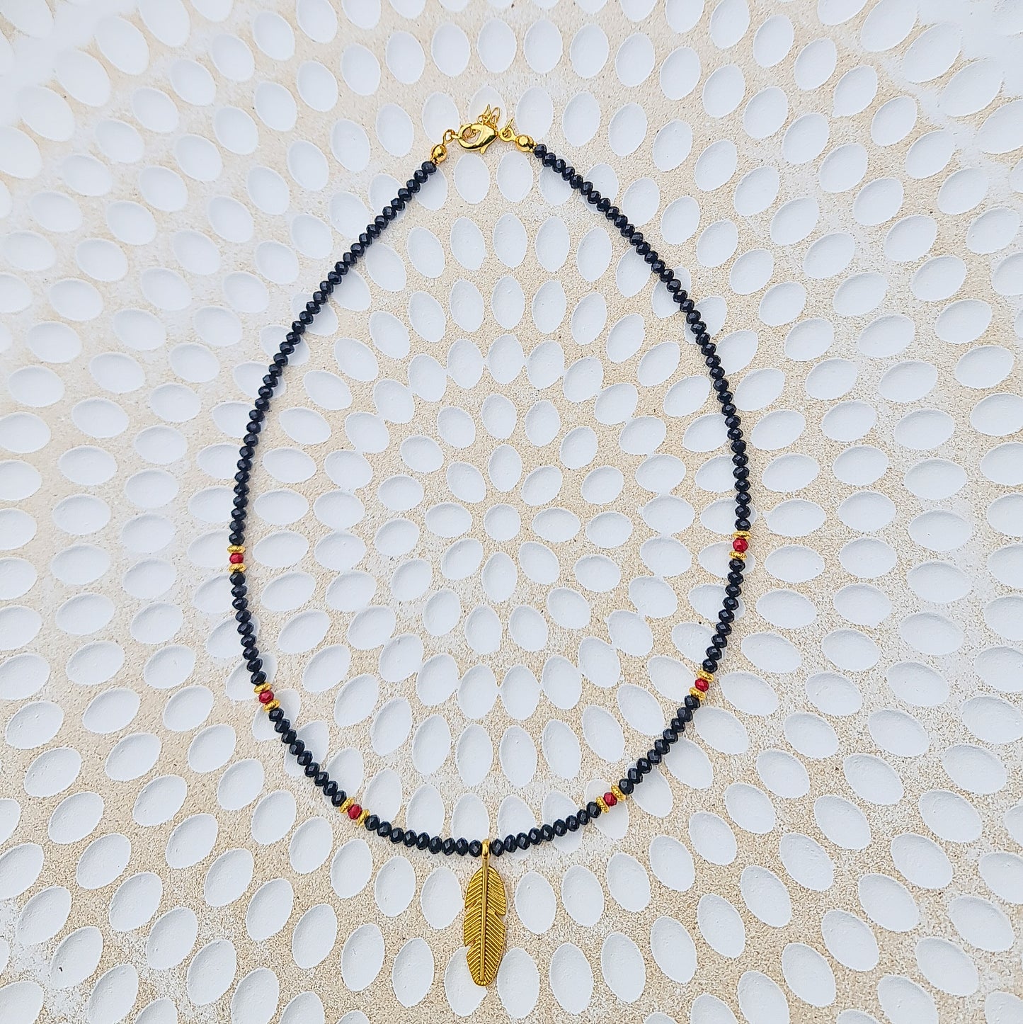 black crystal bead necklace with gold leaf charm, gold leaf necklace, black crystal beaded necklace, black beaded necklace