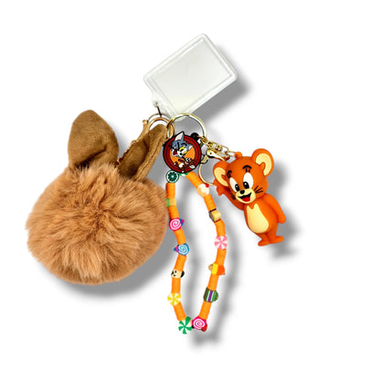 Colorful bag charm Tom and Jerry Sweet Treats Keychain with a fluffy pom-pom, a Tom and Jerry charm, a colorful beaded strap adorned with candy, a picture holder and arcobaleno beads. arcobalenobeads.com.au