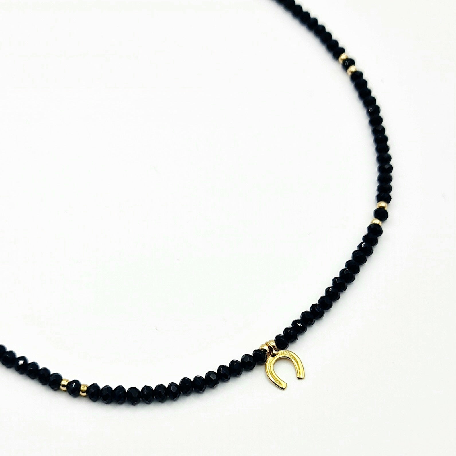 black crystal necklace, crystal bead necklace, gold horseshoe charm necklace, black bead necklace, gold horseshoe necklace