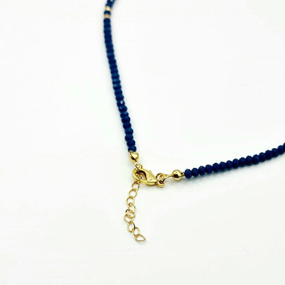 bead by bead crystal navy blue costume jewellery necklace, highlight gold accents good luck charm front veiw, arcobaleno beads