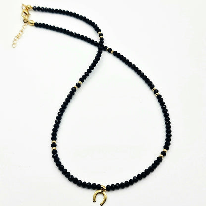 black crystal necklace, crystal bead necklace, gold horseshoe charm necklace, black bead necklace, gold horseshoe necklace